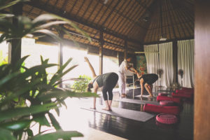People participating in yoga as part of the detox wellness program at Sukhavati Ayurvedic Wellness Retreat Bali
