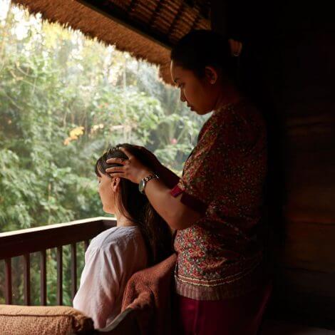 Woman enjoying a focussed scalp massage as part of the Ayurvedic Healing Program