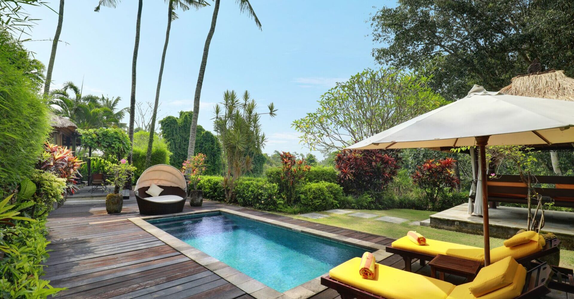 The pool with seating areas of Sukavati's one bedroom private pool villa – 'Amitabha'.