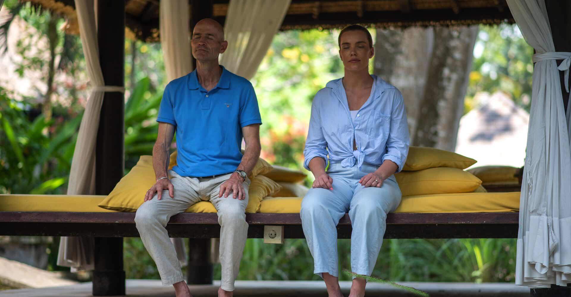 Two people practicing transcendental meditation at Sukhavati Ayurvedic Wellness Retreat in Bali.