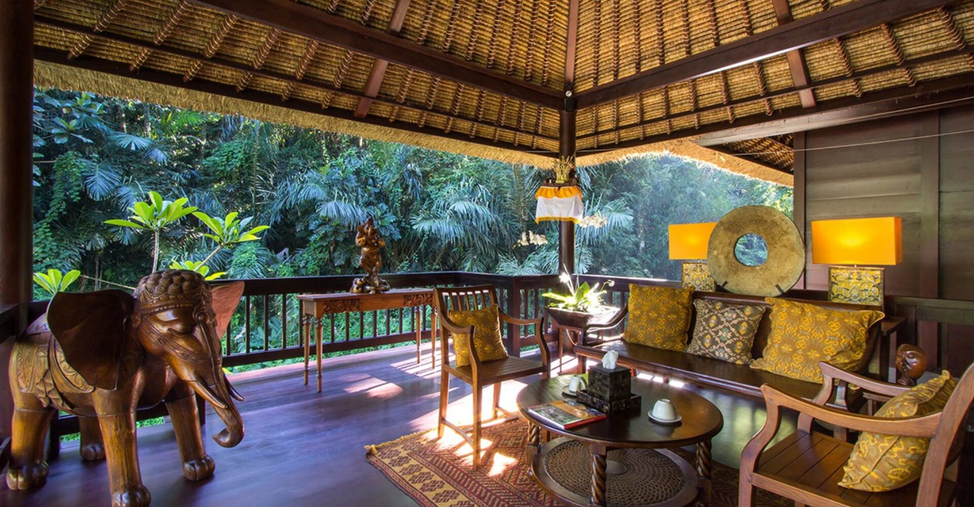 One of the seating areas at Sukhavati Ayurvedic Wellness Retreat in Bali that looks out onto rainforest.